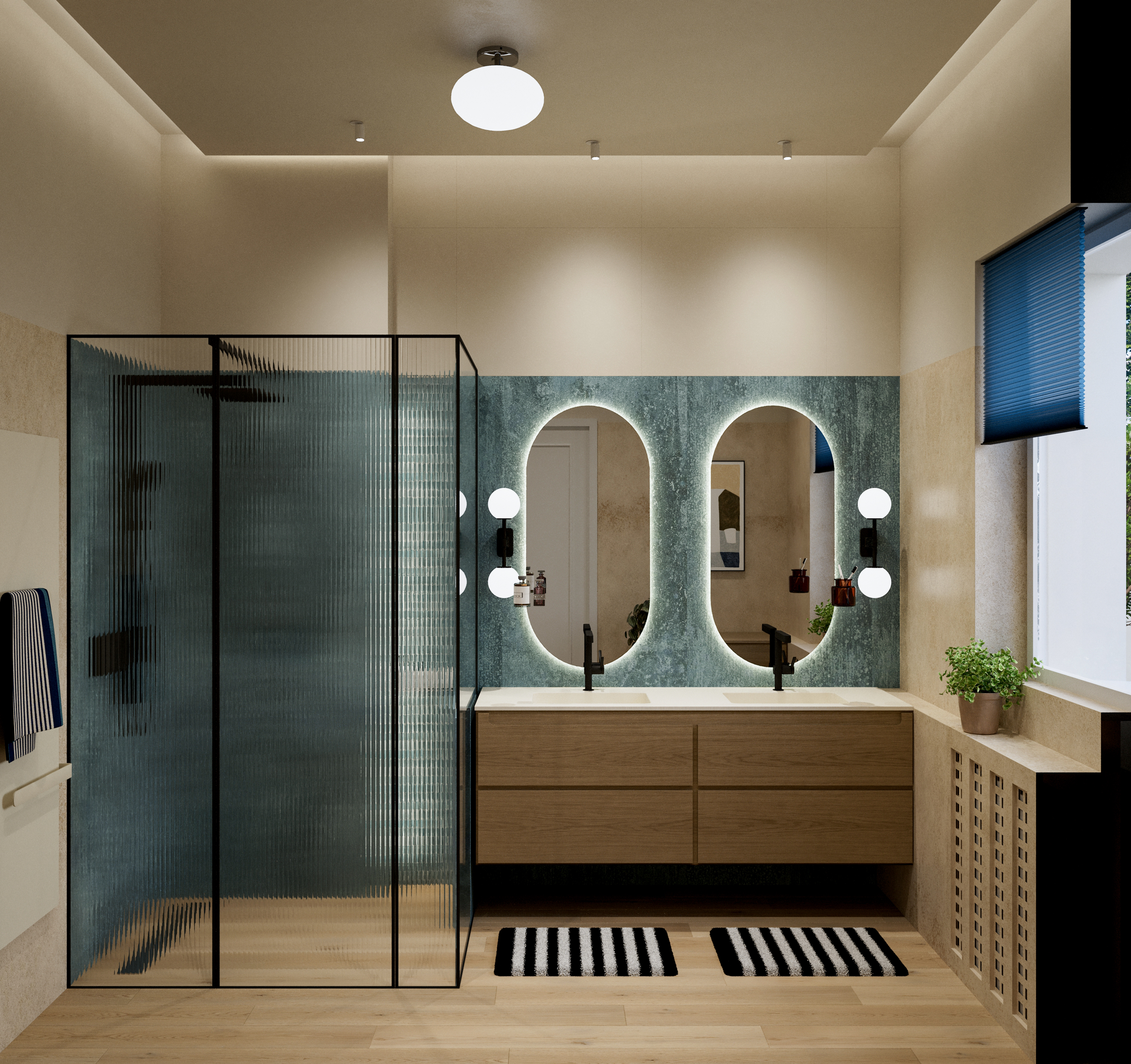 Bathroom with a blue-green stone splashback, two backlit oval mirrors, oak vanity, reeded glass shower screen and slatted oak radiator cover