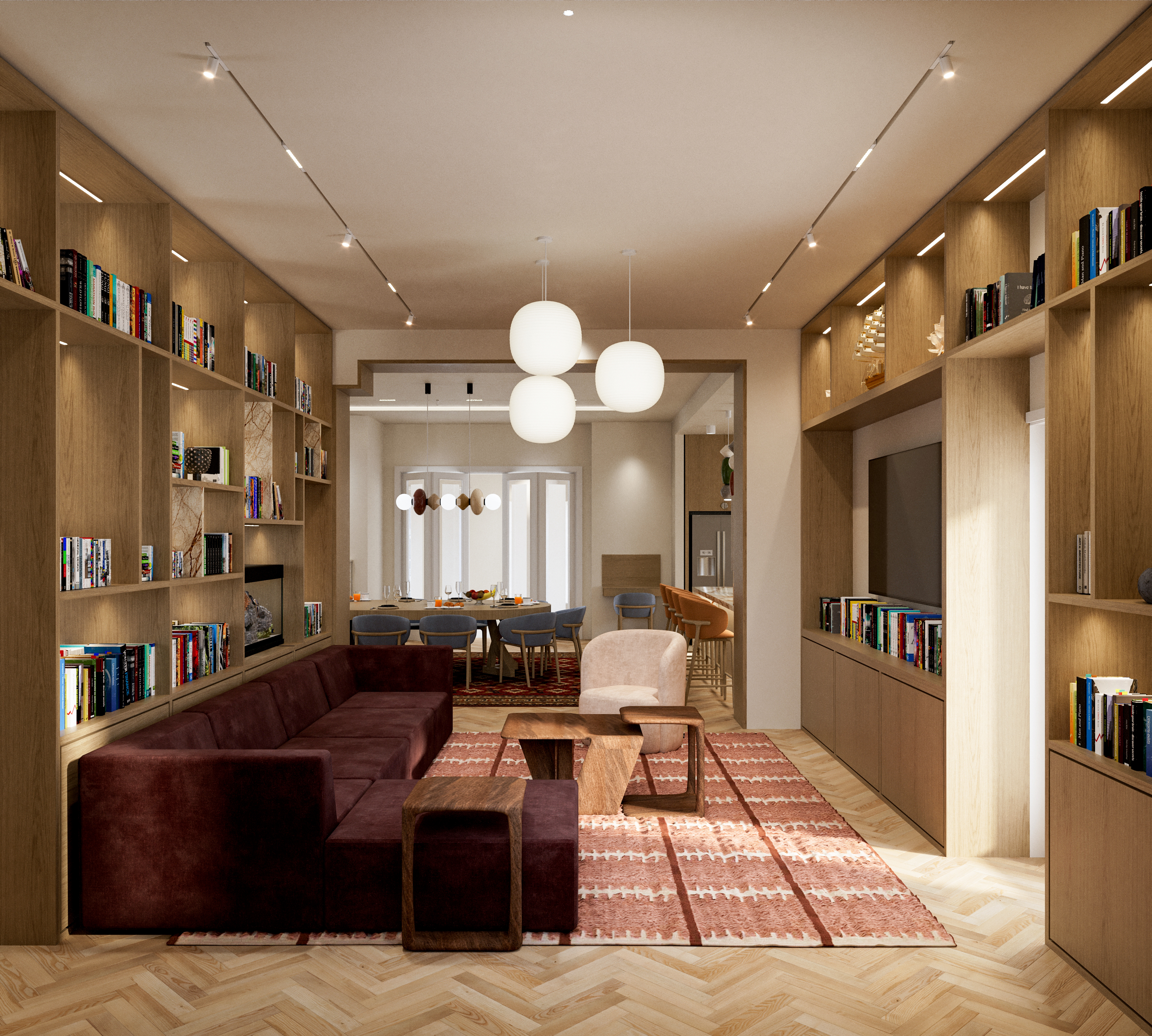 Living room with a burgundy velvet sofa on herringbone oak flooring, bookshelves on both sides and a built-in fireplace, dining room beyond