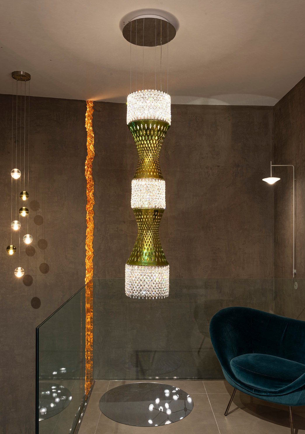 EOS Chandelier installed in a dark interior, the diamonds casting a light pattern on floor and wall