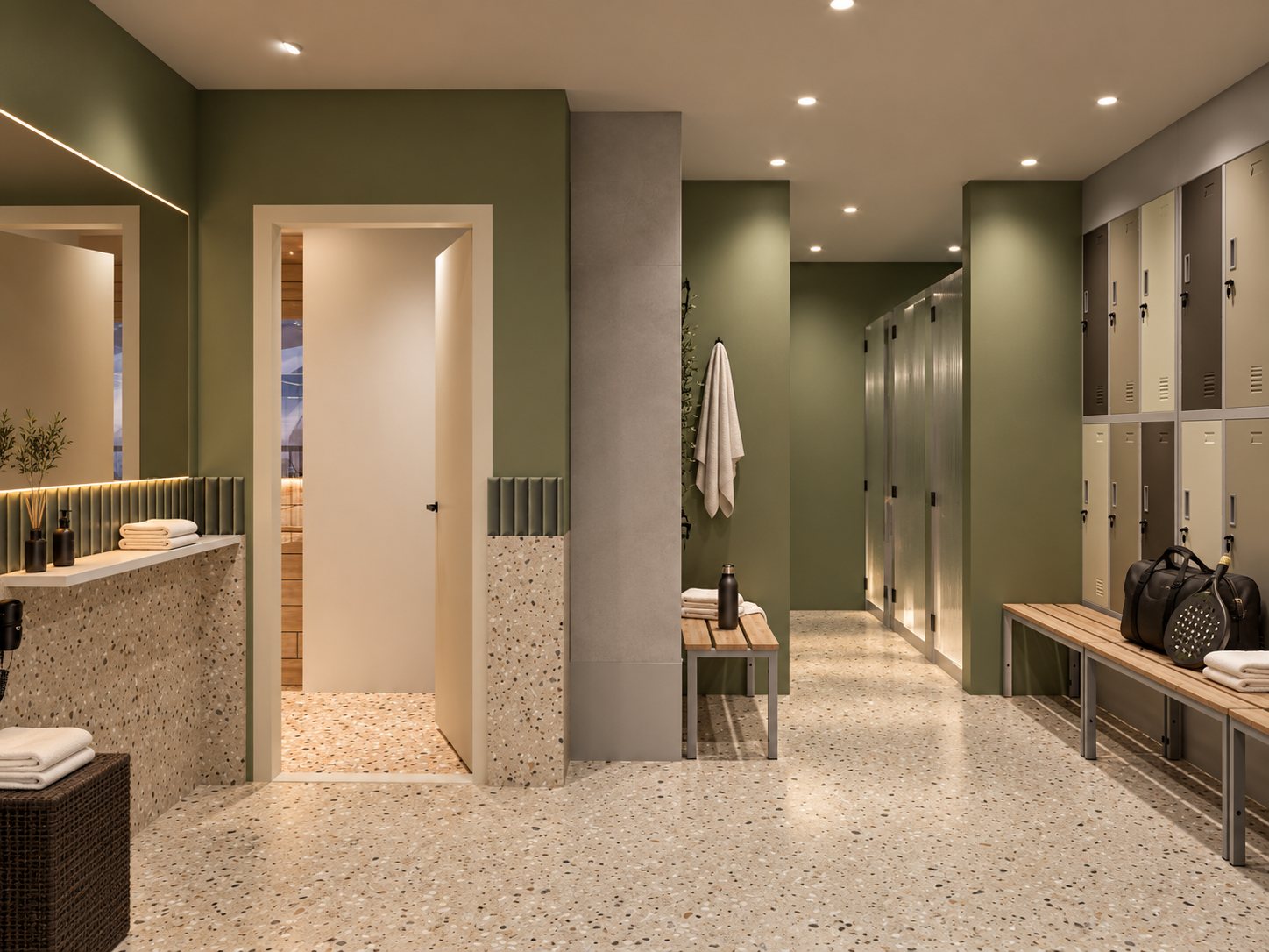 Changing-room corridor with green walls, terrazzo floor, a ribbed tile band, timber benches, lockers and reeded-glass shower cubicles